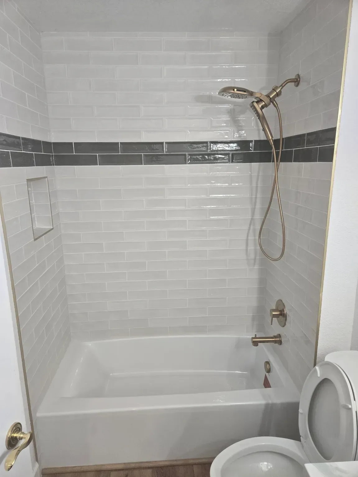 modern bathroom remodel with black and white shower tile