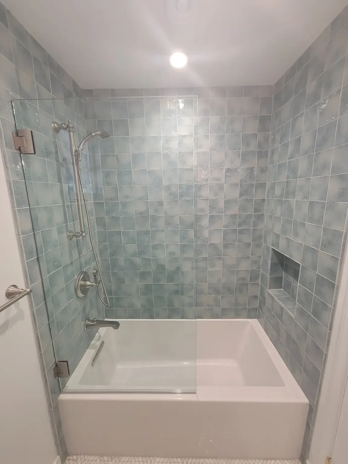 bathroom remodeling project with black tile shower floor