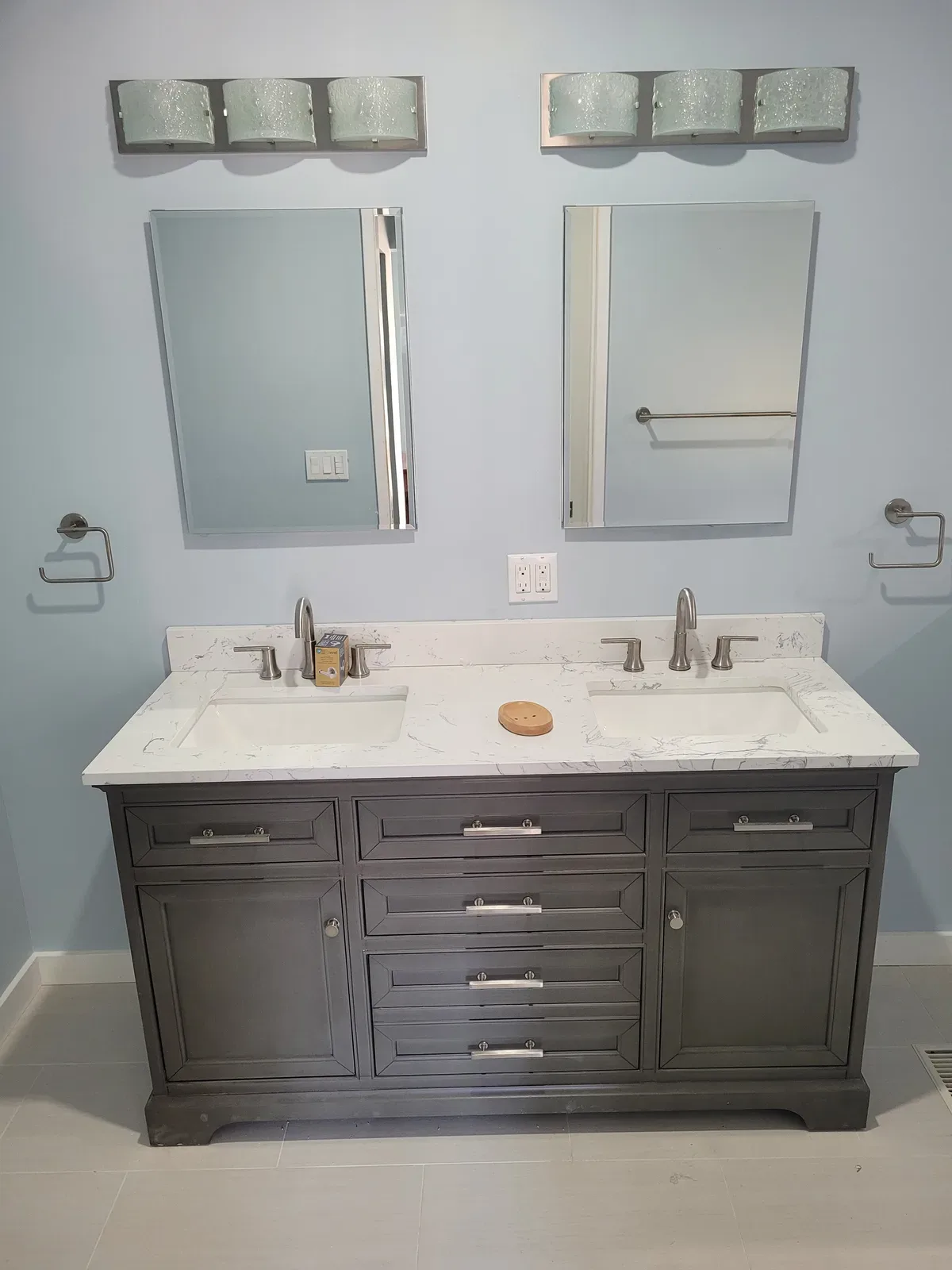 bathroom remodel with black shower tile and modern fixtures